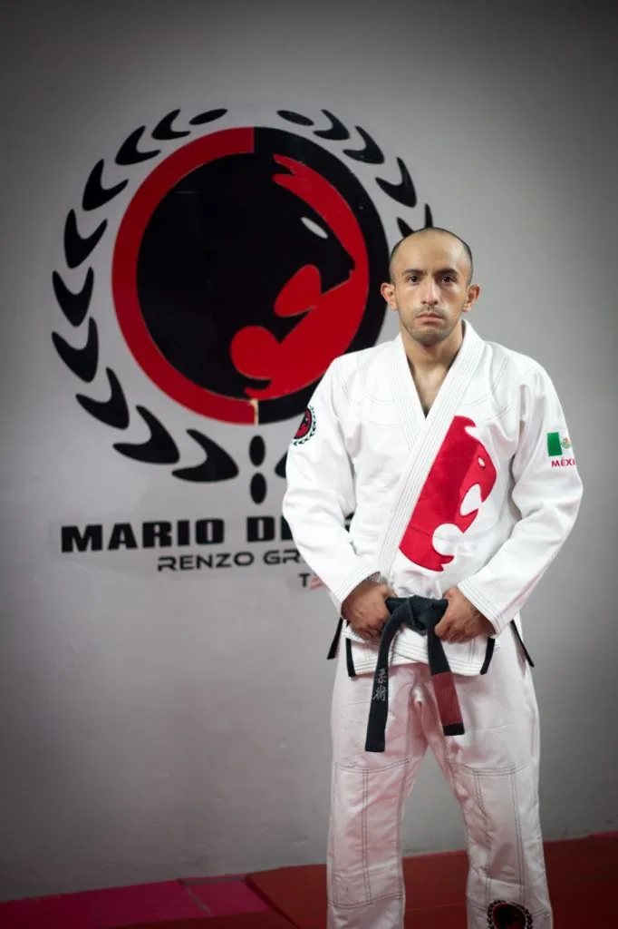 Jiu Jitsu NEZA — a six-page own site publishing address, telephone, WhatsApp, email, a full weekly timetable labelled gi and no-gi, a joining fee and the professor's record. Note the site root does not show the address; its contact page does
